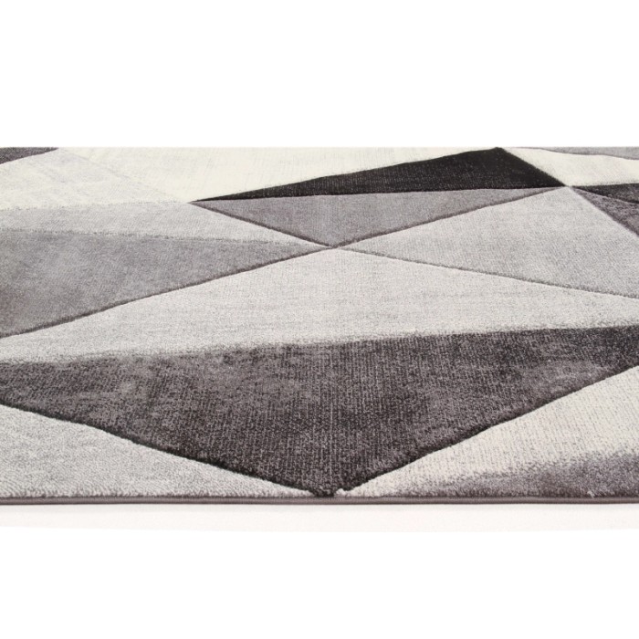 Tappeto moderno t.b.t. con motivo geometrico nei toni del grigio e bianco.