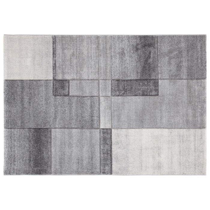 Tappeto moderno con motivo geometrico nei toni del grigio e bianco.