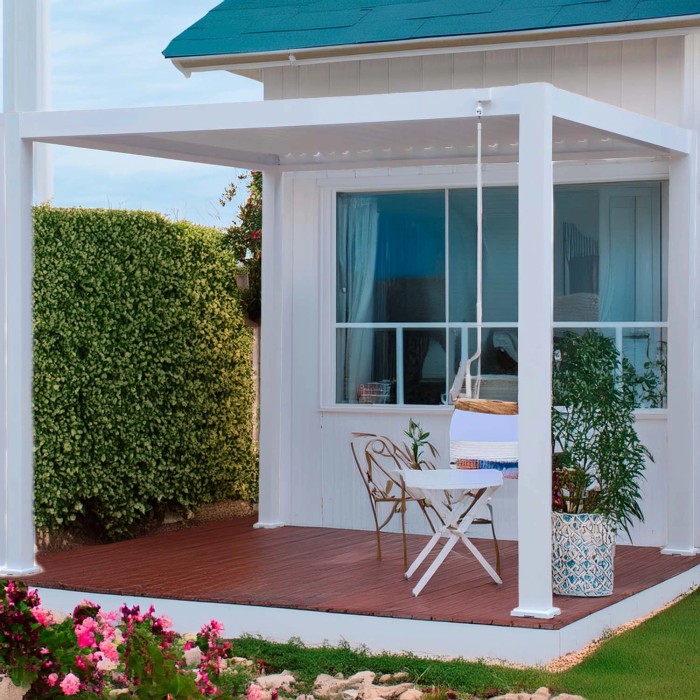 Gazebo bianco t.b.t. con tavolo e sedie su un patio.