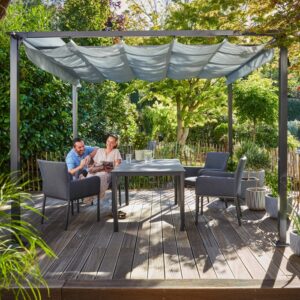 Gazebo Texhoma grigio 300x300 cm con tetto pieghevole in giardino con tavolo e sedie.