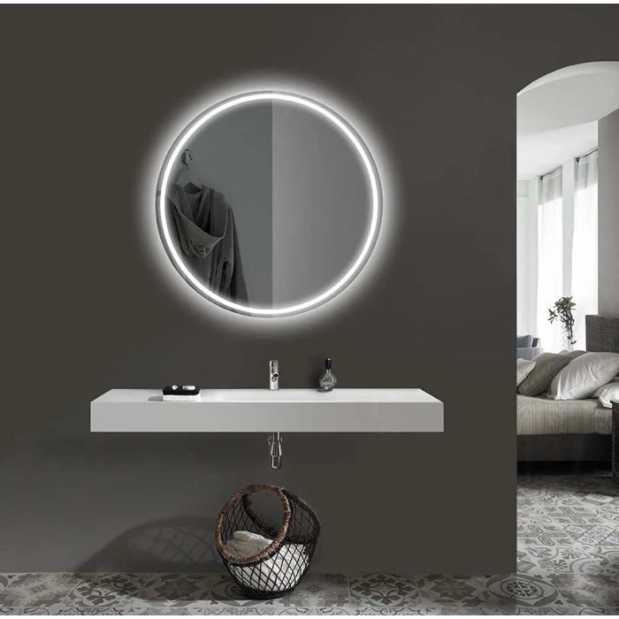Specchio LED rotondo di t.b.t. sopra un mobile bagno bianco.