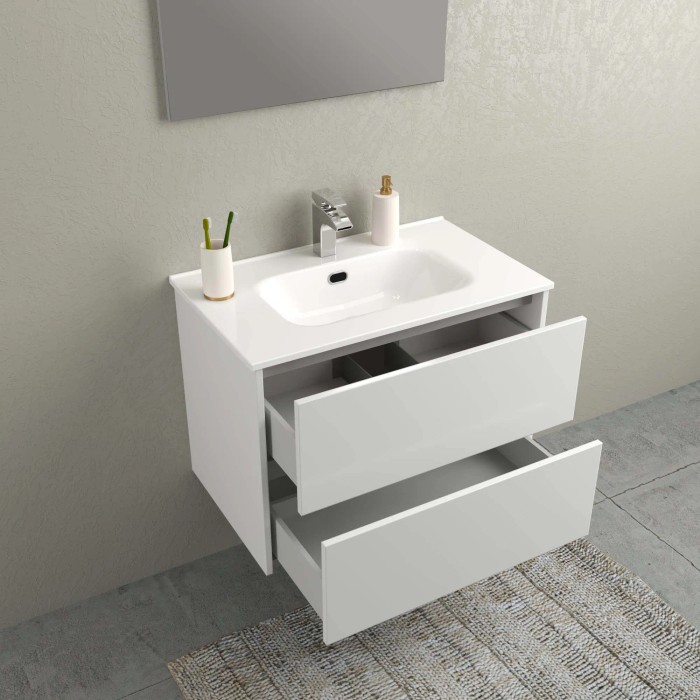 Mobile bagno t.b.t. bianco con due cassetti aperti e lavabo da appoggio.