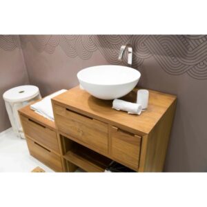 Lavabo d'appoggio t.b.t. su mobile in legno con cassetti e ripiano.