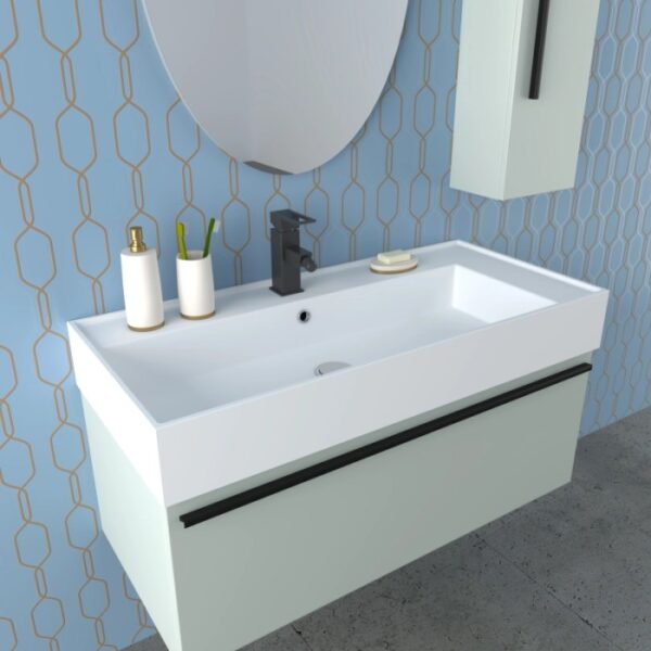 Set di mobili da bagno moderni con lavabo, specchio e mobile base in bianco e verde pastello.