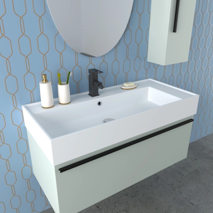 Set di mobili da bagno moderni con lavabo, specchio e mobile base in bianco e verde pastello.