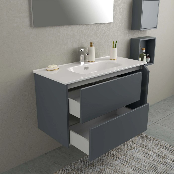 Mobile bagno grigio con sistema di cassetti aperti e lavabo bianco.