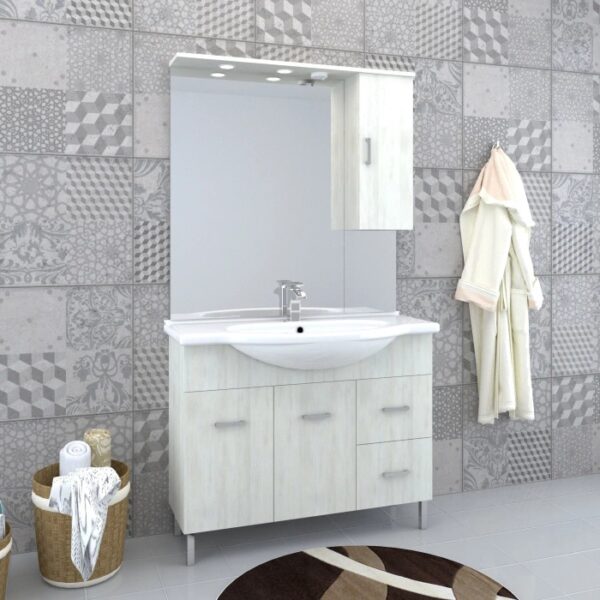 Set di mobili da bagno chiari con lavabo, specchio e armadietto per il bagno.