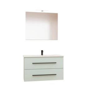 Moderno set di mobili da bagno azzurro chiaro con lavabo, mobile sottolavabo con due cassetti e specchio con lampada.