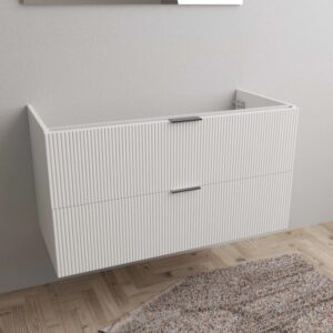Mobile bagno t.b.t. bianco con due cassetti e frontale a coste nel bagno.
