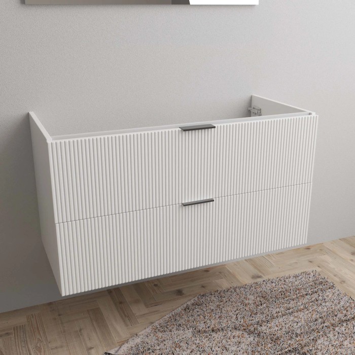 Mobile bagno t.b.t. bianco con due cassetti e frontale a coste nel bagno.