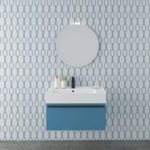 Set di mobili da bagno blu con specchio rotondo e lavabo da appoggio moderno.