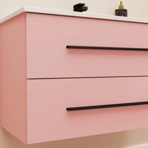 Mobile bagno rosa con due cassetti e maniglie nere. Arredo bagno.
