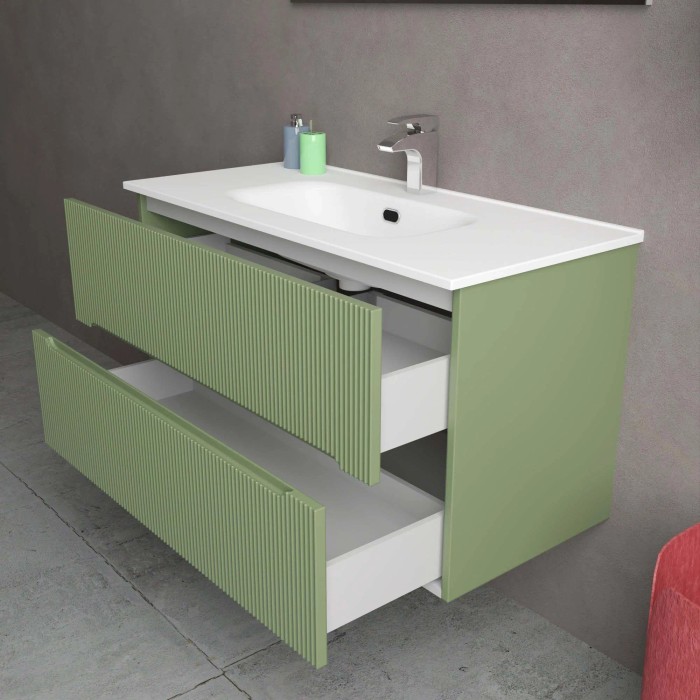Mobile bagno verde con due cassetti e lavabo bianco.