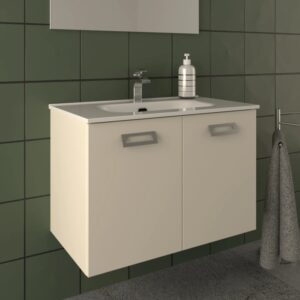 Mobile bagno beige con lavabo e rubinetto su parete verde.