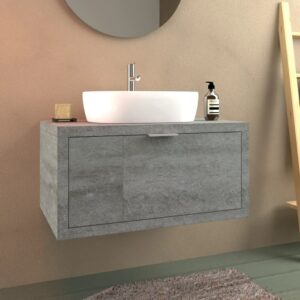 Mobile bagno grigio con lavabo da appoggio.