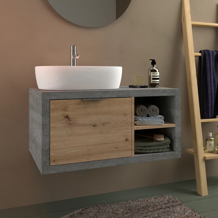 Mobile bagno moderno con lavabo, mobiletto effetto cemento e frontale in legno.