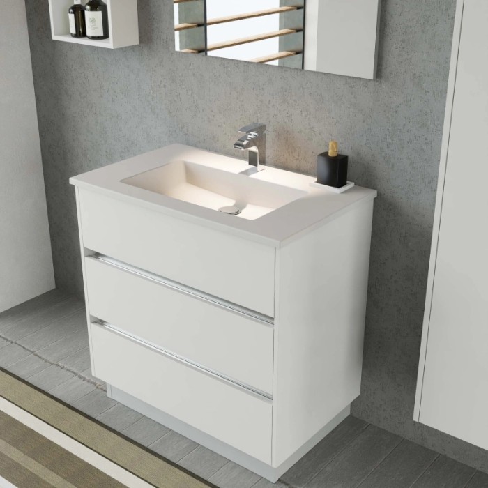 Mobile bagno bianco con tre cassetti e lavabo da appoggio. Arredo bagno.