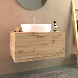 Mobile bagno in legno con lavabo d'appoggio e rubinetto. Arredo bagno per il design del bagno.