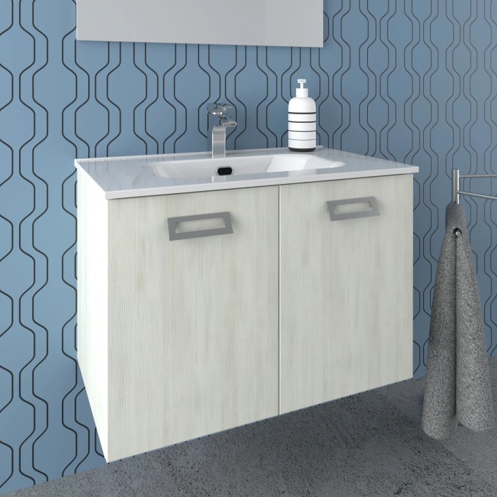 t.b.t. Mobile bagno con lavabo e rubinetto davanti a una parete blu.