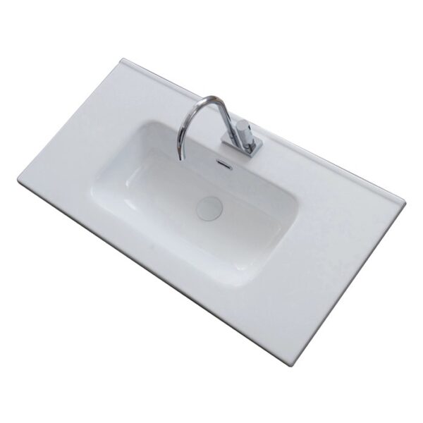 Lavabo da appoggio t.b.t. bianco con rubinetto, vista dall'alto.