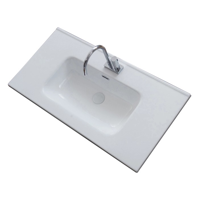 Lavabo da appoggio t.b.t. bianco con rubinetto, vista dall'alto.