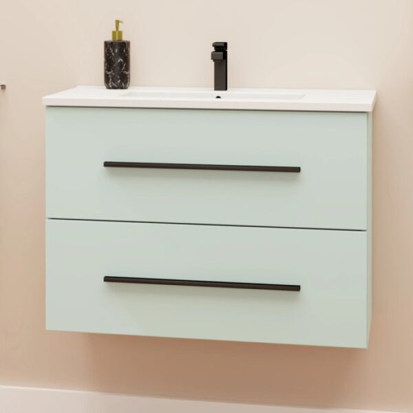 Mobile bagno sospeso color menta con due cassetti e maniglie nere, parte della serie arredo bagno.